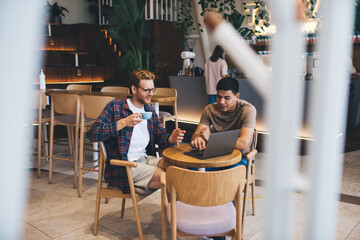 Multiracial business men working in office space