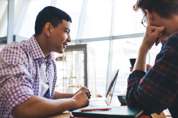 Multiracial business men working in office space