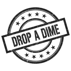 DROP A DIME text written on black vintage round stamp.