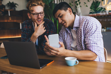 Multiracial business men working in office space