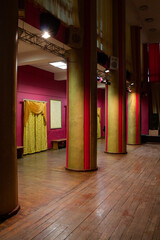 A bright corridor, with tiled square tiles, with through doors made of natural wood are shot in a linear perspective. Banner, cover, flyer, layout design
