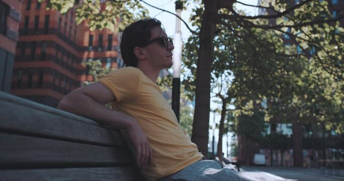Man sits peacefully on park bench