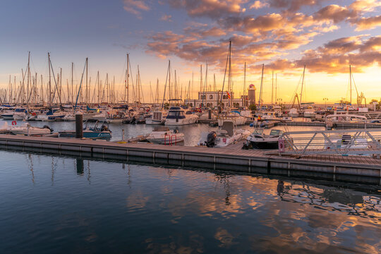 View of boats and lighthouse in Marina Rubicon at sunset, Playa Blanca, Lanzarote, Canary Islands