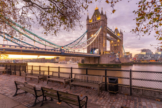 View of Tower Bridge and River Thames with dramatic sky at sunrise, London, England