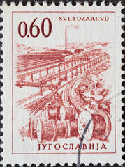 Yugoslavia - circa 1961 : a postage stamp from Yugoslavia, showing a Cable factory in Svetozarevo.
