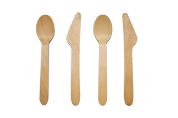 Wooden spoons and knives on a white background. Eco-friendly tableware in the form of two spoons and two knives. The concept of ecological disposable tableware for eating