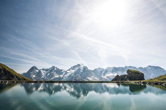 Eiger, Monch and Jungfrau peaks reflected in the unspoiled Engital lake, Murren Birg, Jungfrau Region, Bern Canton, Swiss Alps, Switzerland