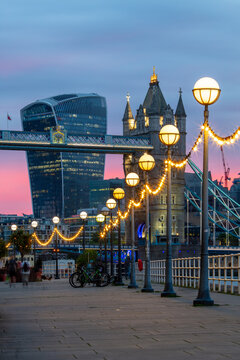 Tower Bridge and the Walkie Talkie building (20 Fenchurch Street) at sunset, from Shad Thames, London, England