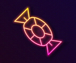 Glowing neon line Candy icon isolated on black background. Happy Halloween party. Vector