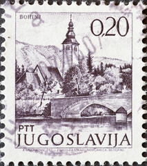 Yugoslavia - circa 1971 : a postage stamp from Yugoslavia, showing a townscape with Church and...