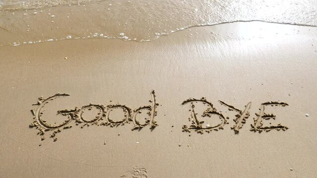 good bye written on the beach