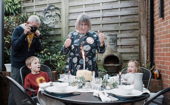 woman in her 70's celebrating her birthday with her family