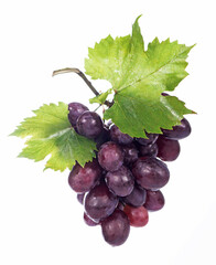 Grape cluster with leaves isolated on the white background