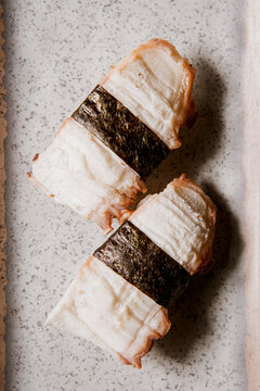Tako nigiri sushi or octopus sushi isolated on a tradicional ceramic plate background, Japanese food. Copy space.