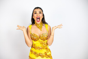 Young beautiful woman wearing carnival costume over isolated white background clueless and confused...