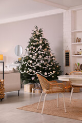 Cozy dining room interior with Christmas tree and festive decor