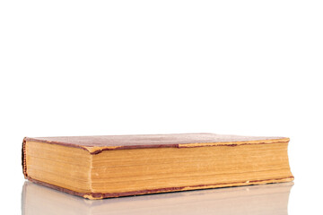 One old book, macro shot, isolated on a white background.