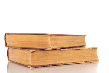 Two old books, macro shot, isolated on a white background.