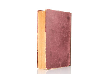 One old book, macro shot, isolated on a white background.