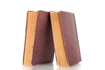 Two old books, macro shot, isolated on a white background.