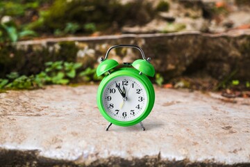 Year change concept with alarm clock on the desk