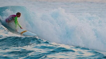 Woman takes off and rides the wave