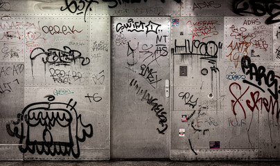 Metal doors full of graffiti and drawings