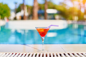 Relaxing vacations with refreshing aperol cocktail by the pool at the all-inclusive resort