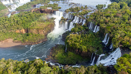 Beautiful aerial view of the Iguassu Falls from a helicopter, one of the Seven Natural Wonders of the World. Foz do Iguaçu, Paraná, Brazil - obrazy, fototapety, plakaty