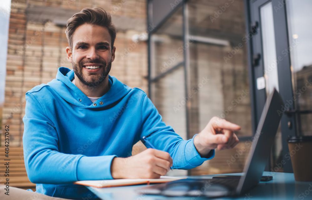 Poster portrait of happy male student with laptop computer and education textbook for e learning research k