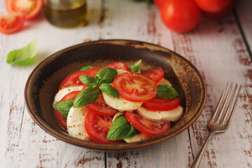 A bowl with traditional Italian caprese salad
