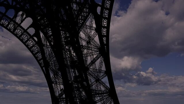 Eiffel Tower in Paris, France (against the background of moving clouds) 