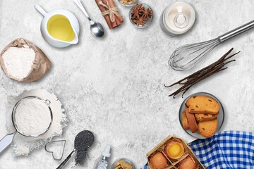 plate with wheat flour and ingredients for making dough for homemade cookies on a desk