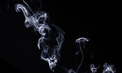 Abstraction created with white smoke on a black background.