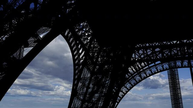 Eiffel Tower in Paris, France (against the background of moving clouds) 
