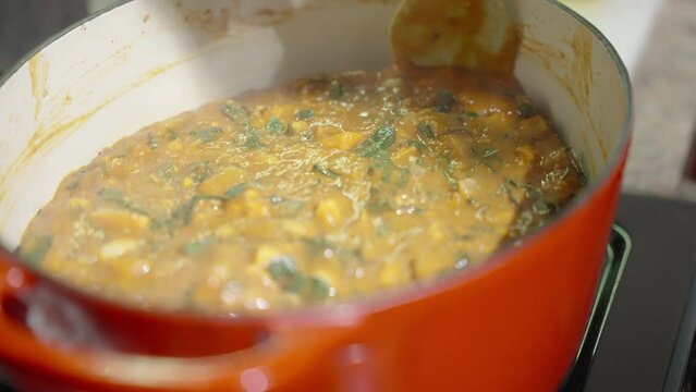Stirring pot of soup