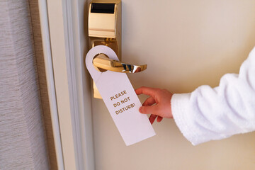 Do not disturb sign on the doorknob of hotel