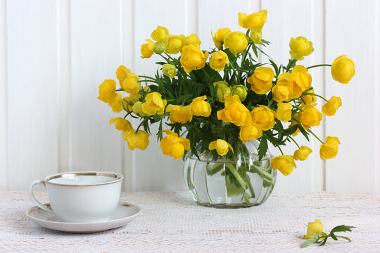 Bouquet Of Yellow Flowers In A Glass Jar