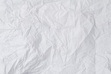 Crumpled white paper background.