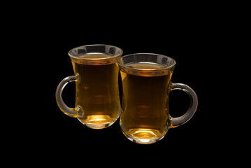 A turkish glass of tea on black background.