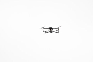 Quadcopter camera drone in flight isolated