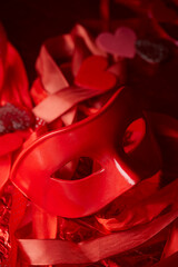 red mask and red ribbons