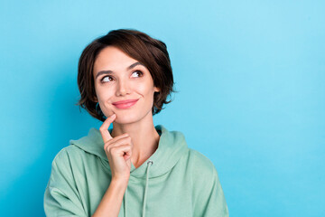 Photo of dreamy thoughtful lady dressed green pullover finger chin looking empty space isolated...