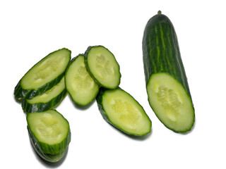 Smooth medium-sized cucumber on a white background. Cucumber slices, isolate. Sliced ​​vegetable.
