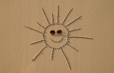 sun drawn on the sand