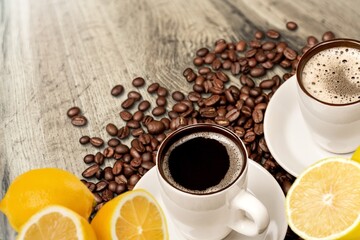 Lemon black coffee in cup, coffee beans, lemon slices