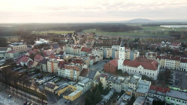 Drone flight over small european town, Central square with administration buildings in poland city, aerial view