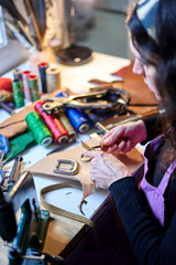 Detail shot Unrecognizable craftswoman working leather