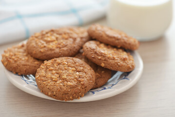 Oatmeal cookies with peanut crumbs and glass of milk
