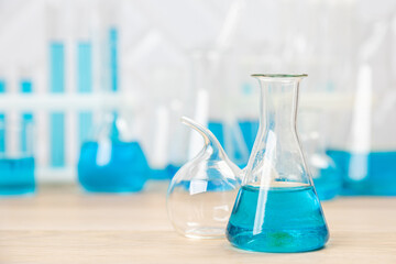 Laboratory glassware with test tubes. flasks, dropper, petri dishes, measuring cups and cylinders for scientific laboratories,